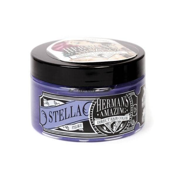 En 115 ml krukke Hermans Hårfarve Stella Blue. Den lilla beholder med sort låg har en sort og hvid etiket i vintage-stil. Denne veganske hårfarve tilbyder en fed forvandling.